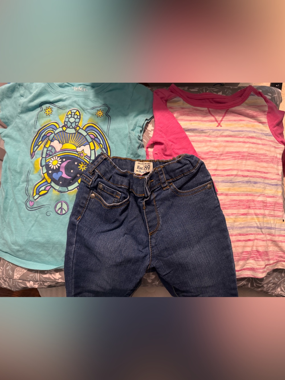 2 shirts and a pair of jeans